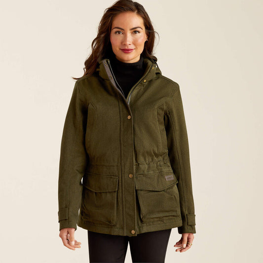 Woman wearing a green jacket on a beige background