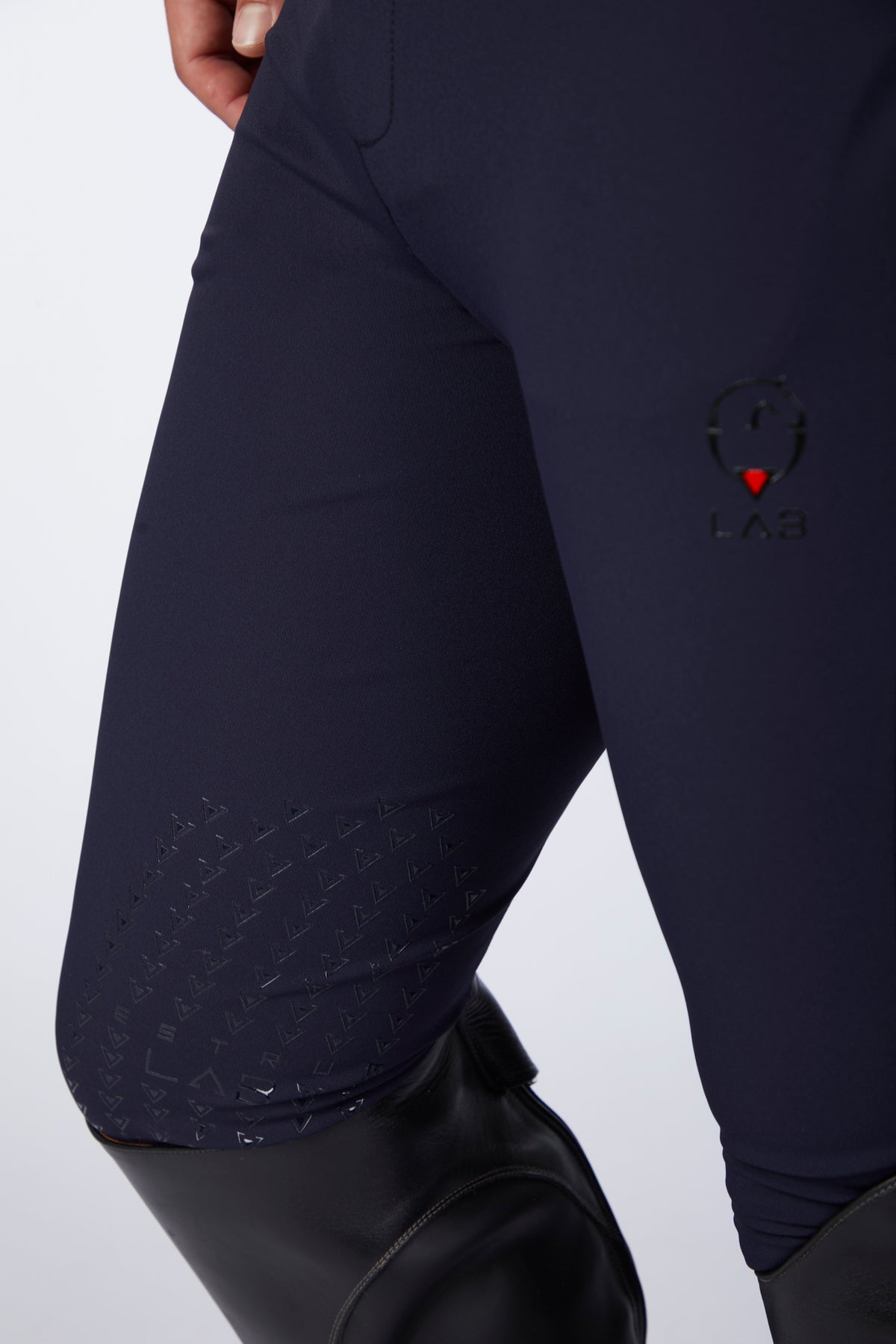 Navy blue leggings with a logo on a white background