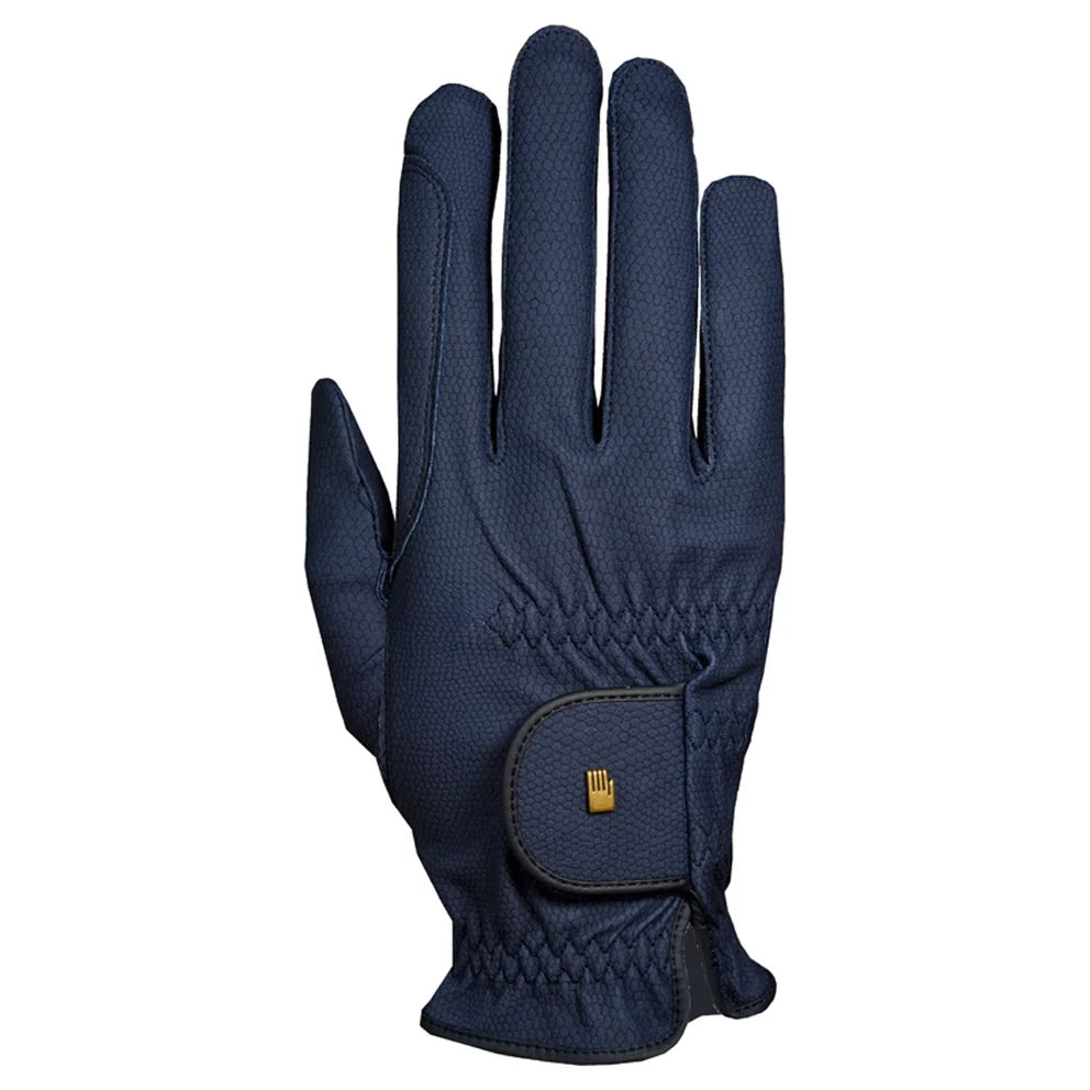 A single navy blue textured riding glove shown from the back, featuring a small gold logo patch on the wrist strap, set against a plain white background.