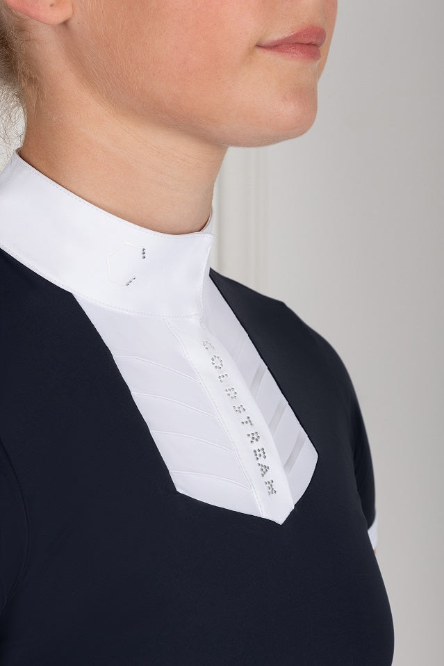 Detail of a white bib on a navy competition shirt