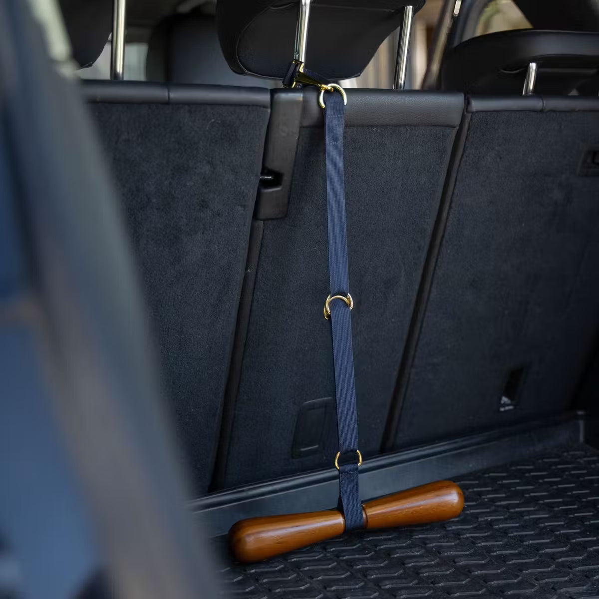 Saddle rack with a wooden object on a car seat