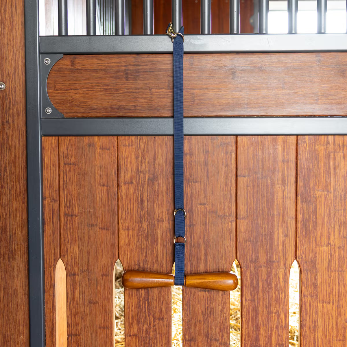 Wooden stable door with a strap and latch