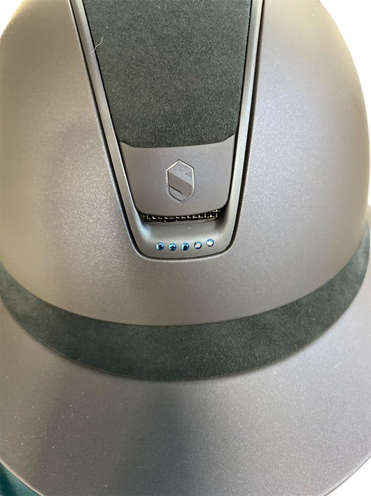 Close-up of navy helmet with five swarowski crystals on a white background
