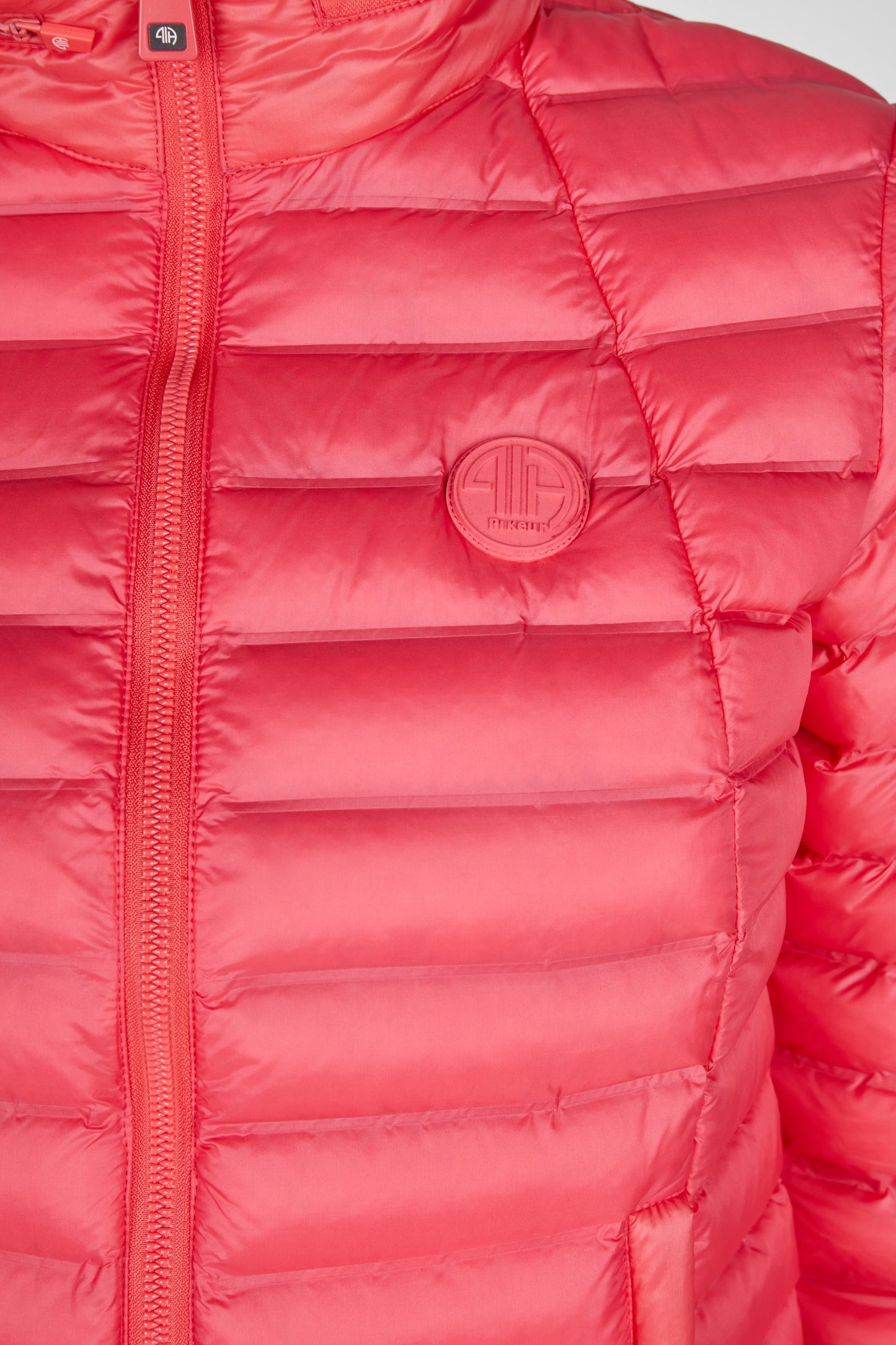 Badge close up on a pink puffer jacket