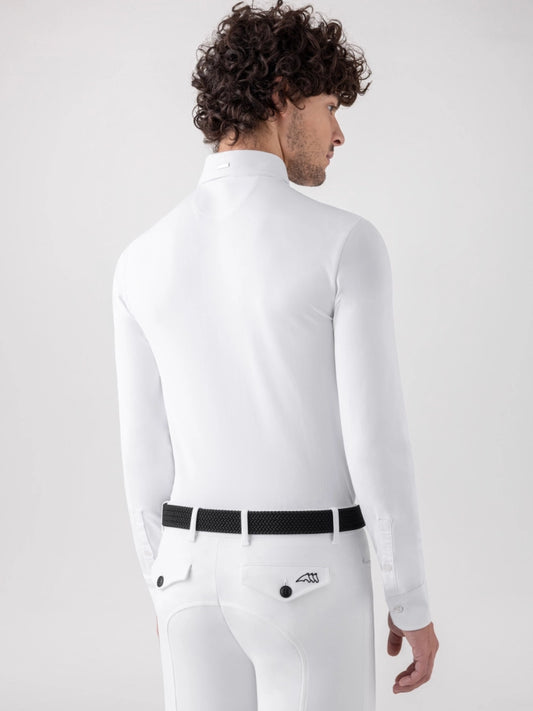 A man shown from the back wearing a white long-sleeve collared shirt, white breeches with a black belt, and a small white logo patch on the back pocket, against a light gray studio background.