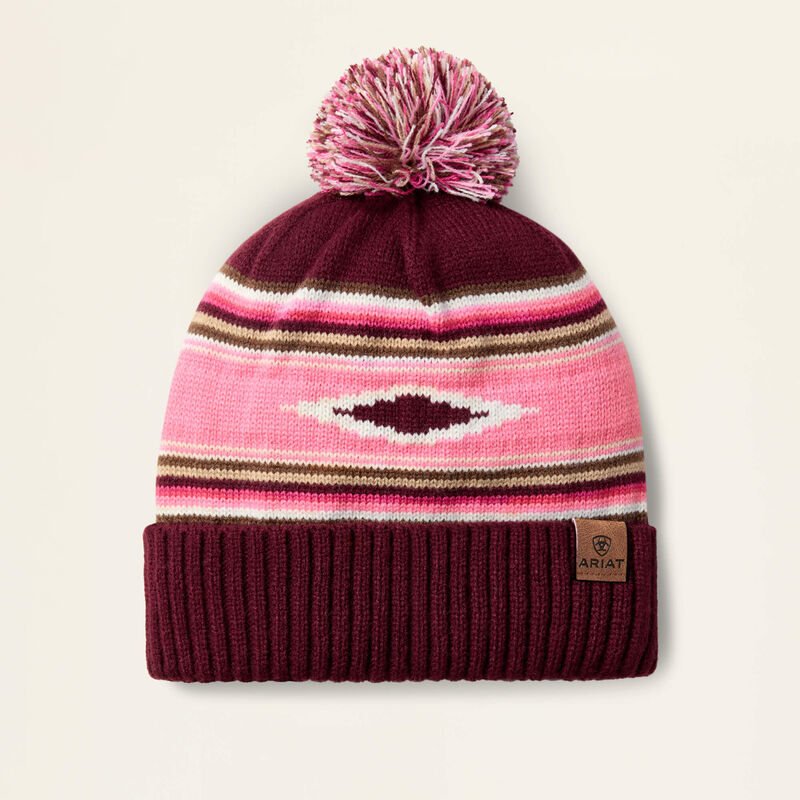 Pink beanie on a beige background