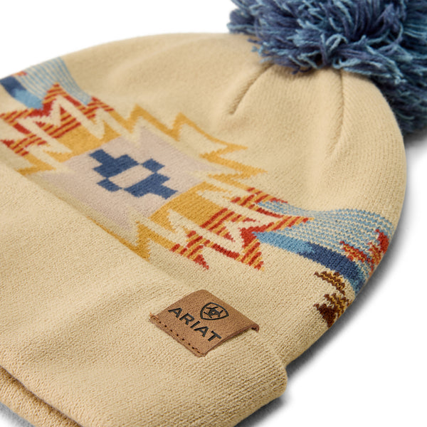 Beige beanie lying flat on a white background