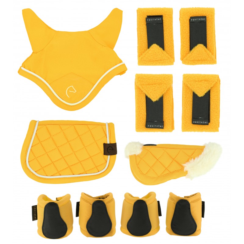Set of yellow equestrian protective gear including a saddle pad, girth straps, and leg wraps on a white background.