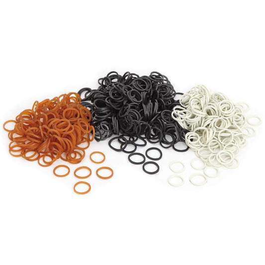 Three piles of rubber bands in orange, black, and white, arranged on a plain white background.