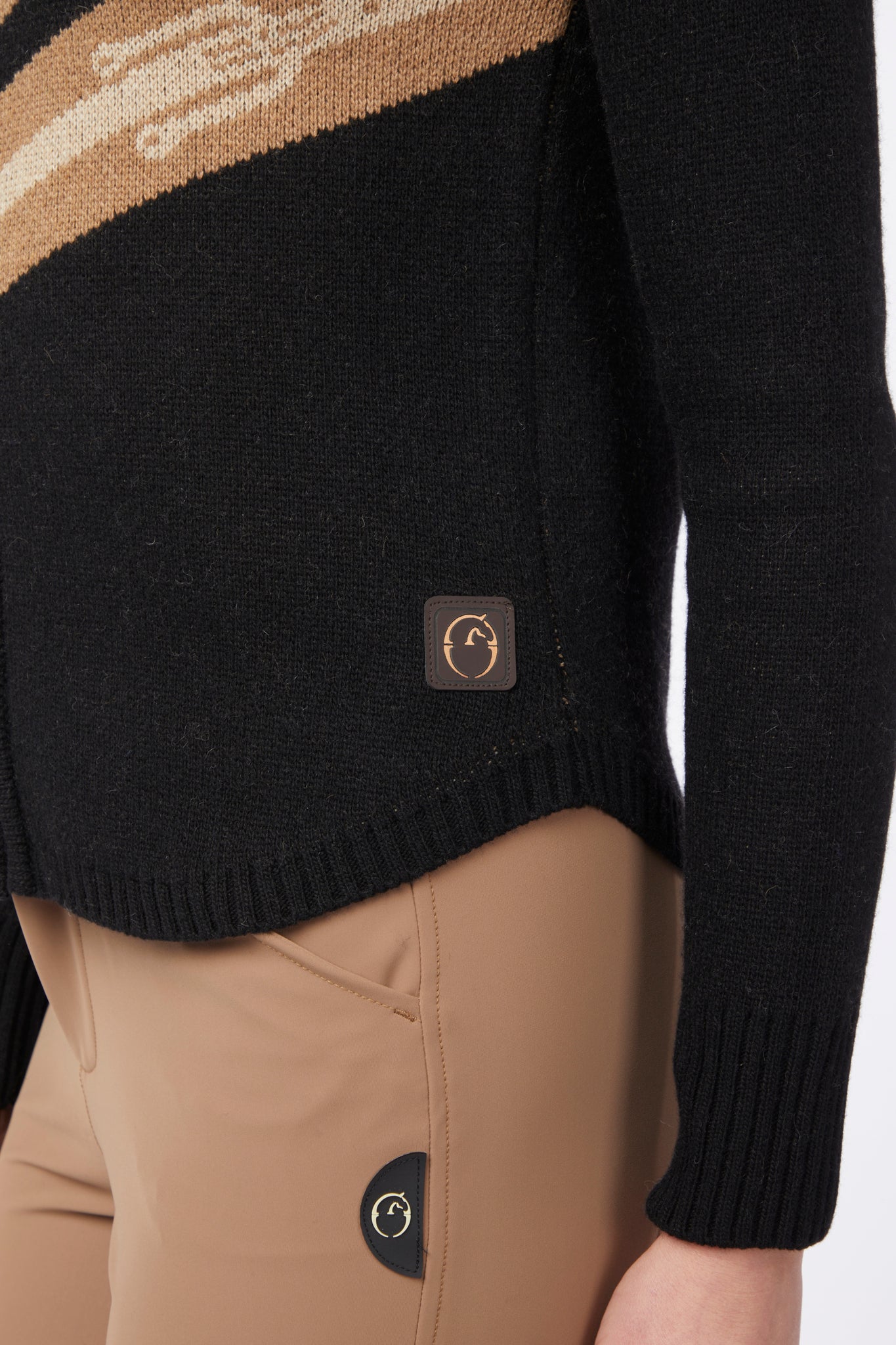 Black sweater with a brand logo on a white background