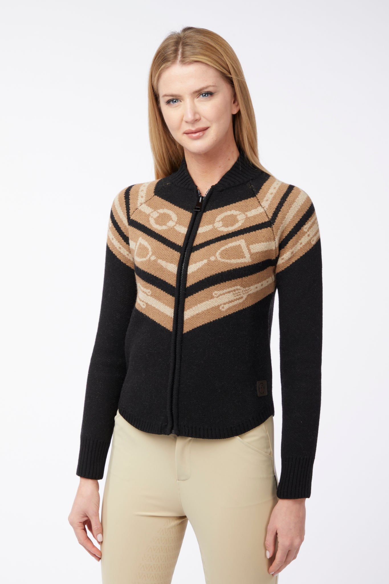 Woman wearing a black and beige patterned jacket on a white background