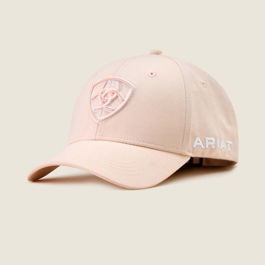 Pink cap with Ariat logo on a beige background