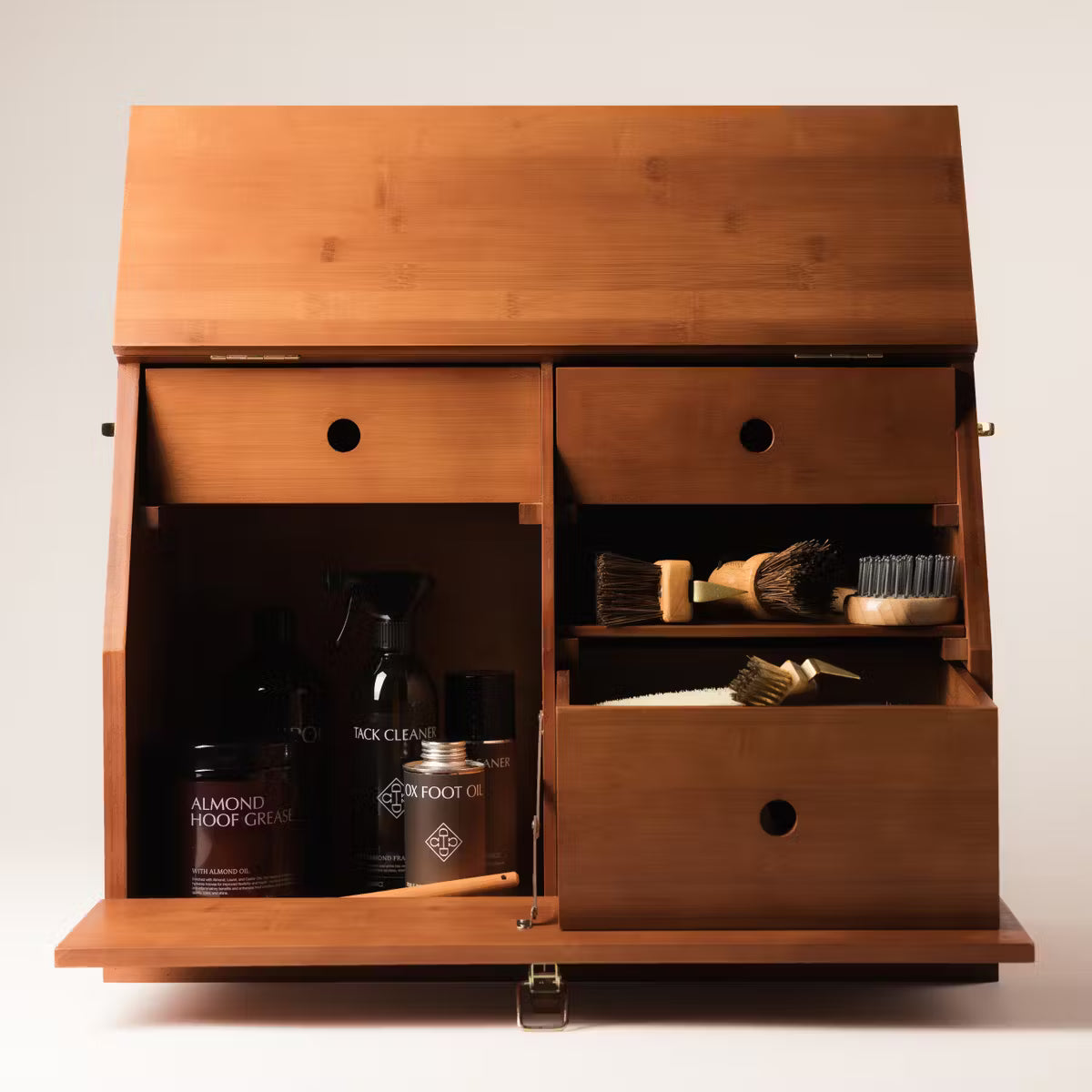 Wooden cabinet with grooming products inside on a white background