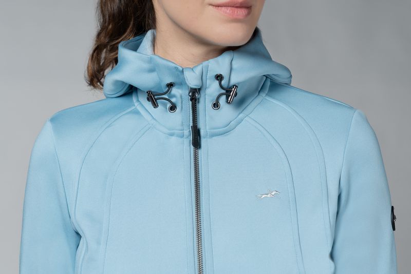 Close up of blue jacket with hood and horse logo 