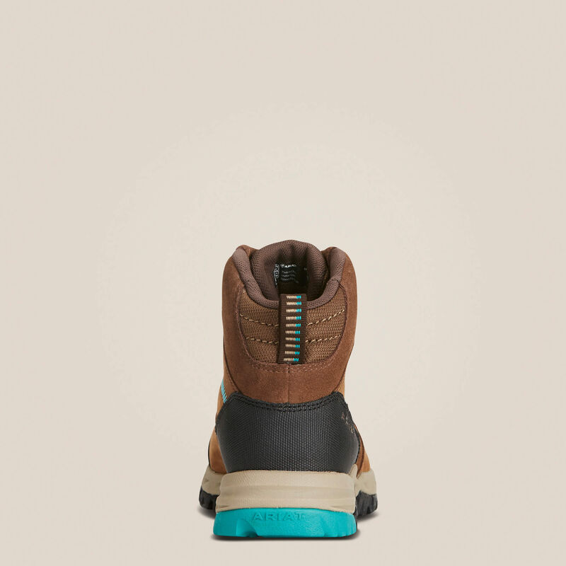 Back of a brown hiking boot on a beige background