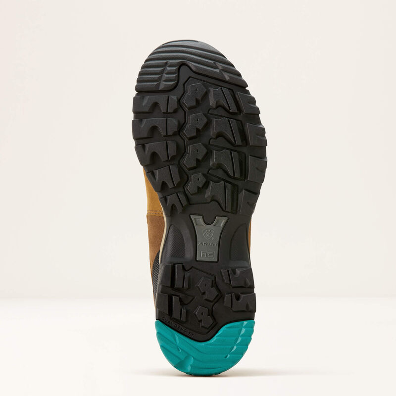Sole of a brown hiking boot with black and turquoise sole on a beige background