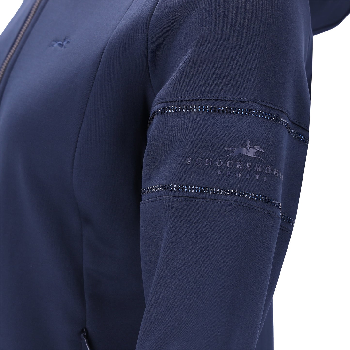 Close-up of a navy blue jacket sleeve featuring decorative rhinestone trim and an embossed Schockemöhle Sports logo on the upper arm.