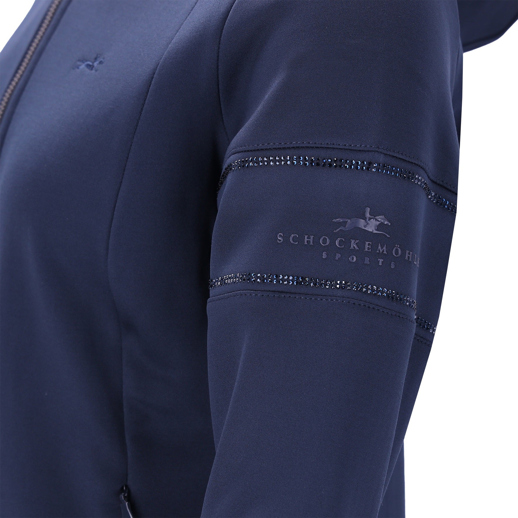 Close-up of a navy blue jacket sleeve featuring decorative rhinestone trim and an embossed Schockemöhle Sports logo on the upper arm.