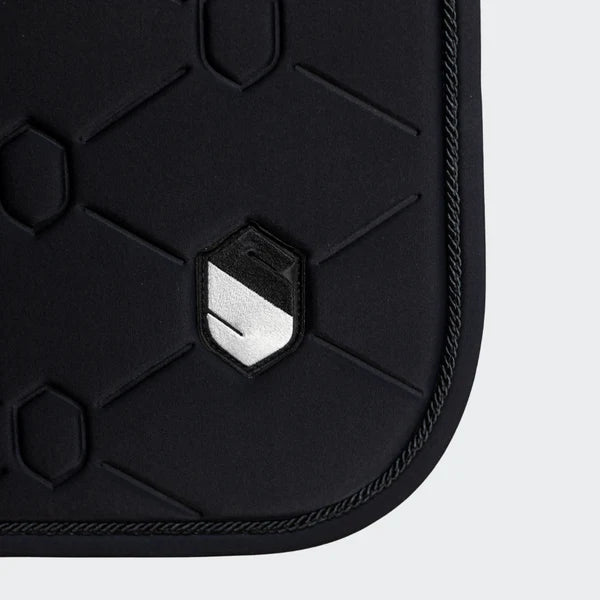 Detail of a black Samshield saddle pad on a white background