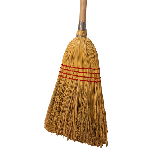 Traditional broom with a wooden handle on a white background