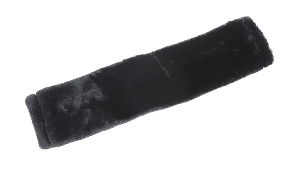 Black velvety object on a white background