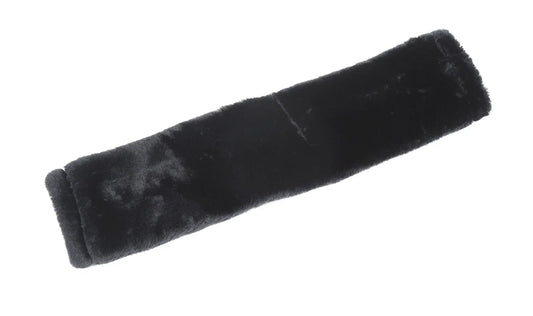 Black velvety object on a white background