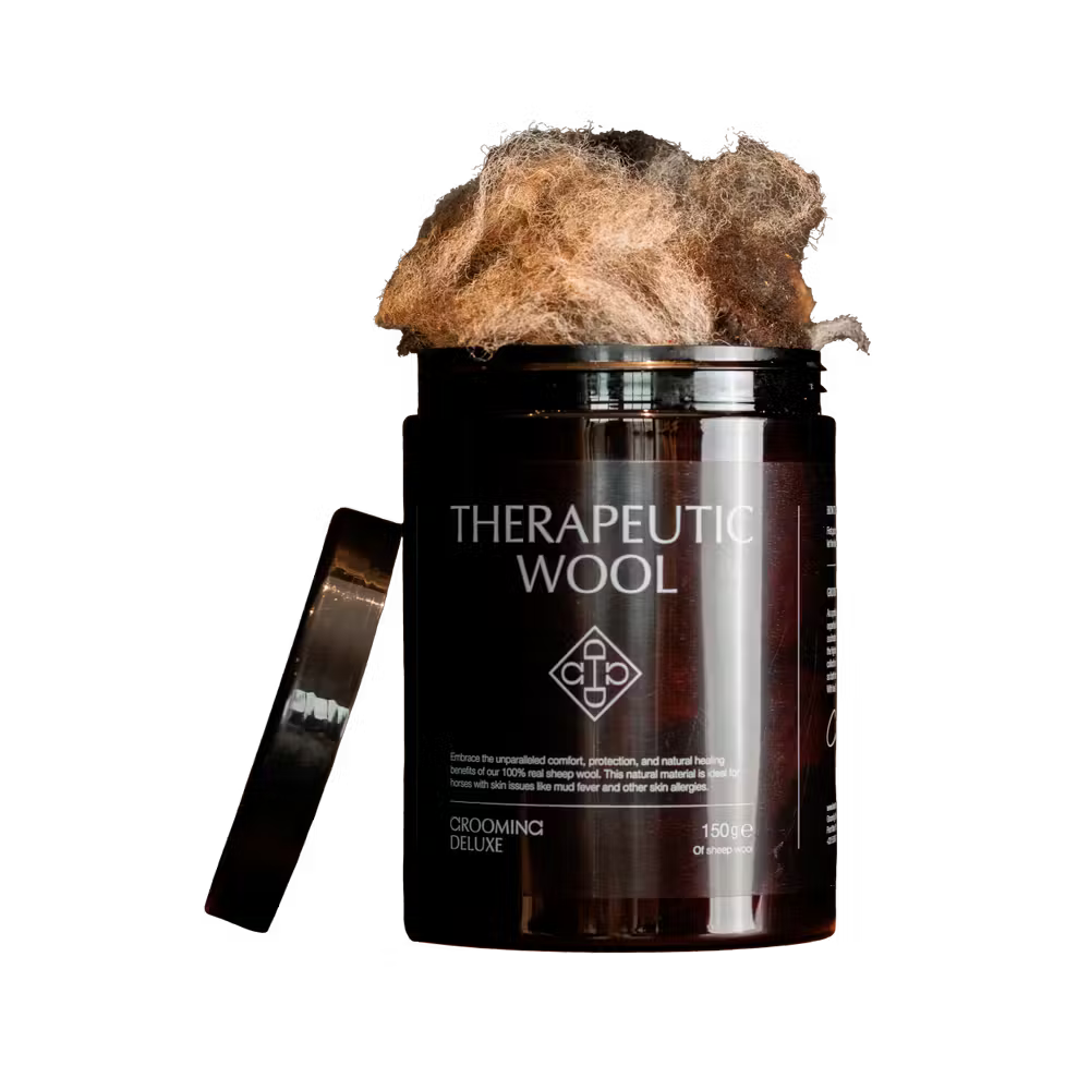 Container of 'Therapeutic Wool' with fluffy brown wool on a black background