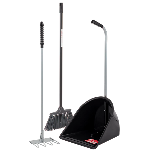 Rake, brush and black stable tidee on a white background