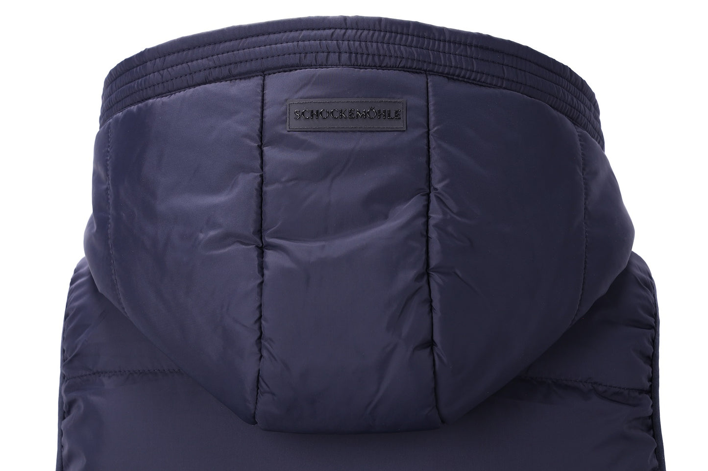 Close-up of the hood of a dark navy puffer jacket, showing quilted stitching and a small black brand label that reads 'SCHOCKEMOHLE'.