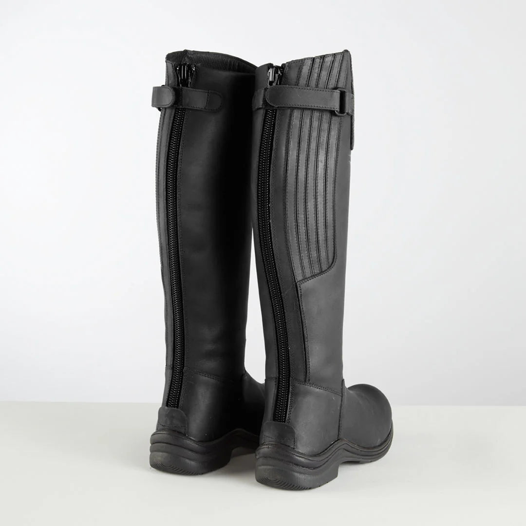Pair of black long riding boots on a white background