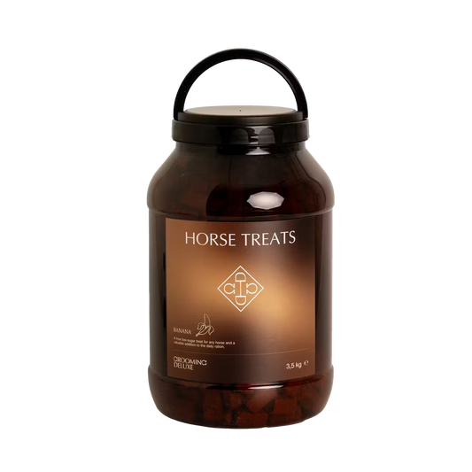 Tub of horse treats on a white background