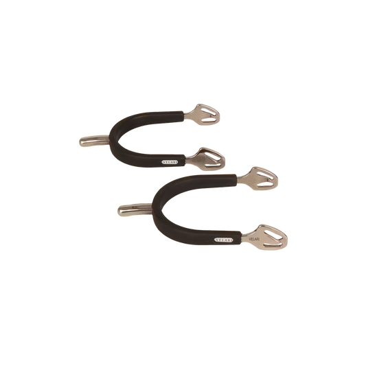 Metal spurs with intricate design on a white background