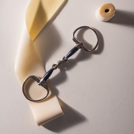 Horse bit with bit tape on a beige background