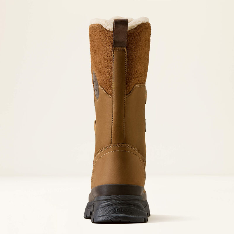 A single mid-calf winter boot shown from the back, featuring a brown suede and leather upper, a black rubber sole, and a white shearling lining at the top, set against a plain off-white background.