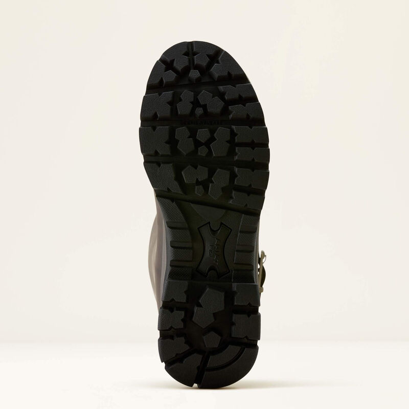 Black boot sole on a light beige background