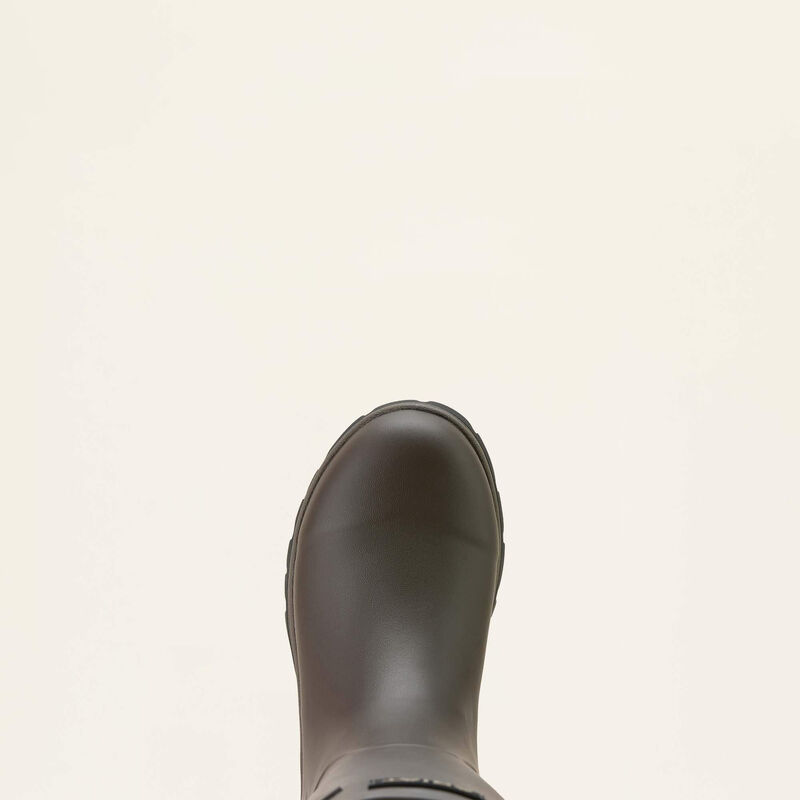 Brown rubber boot on a light beige background