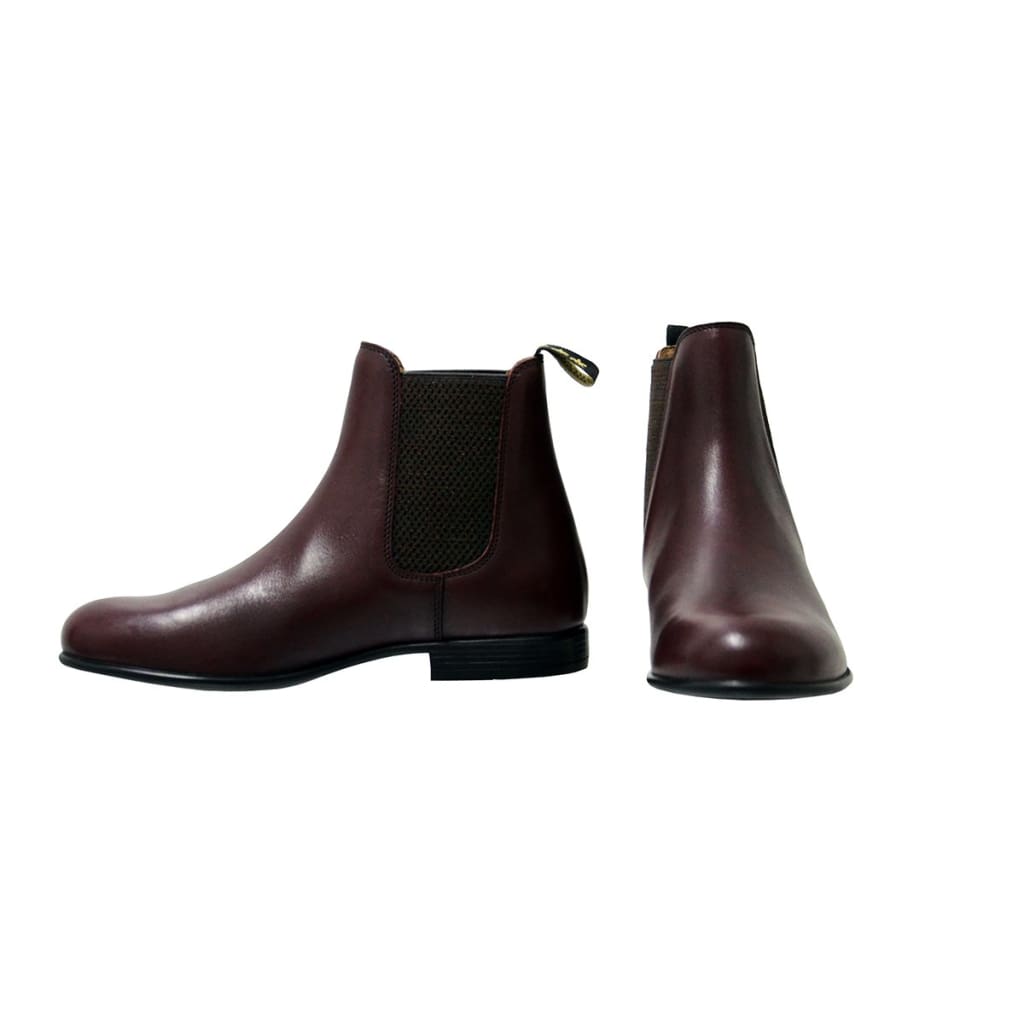 A pair of oxblood red Supreme Products children's Jodhpur boots with elastic sides and a heel loop, crafted from full grain leather.